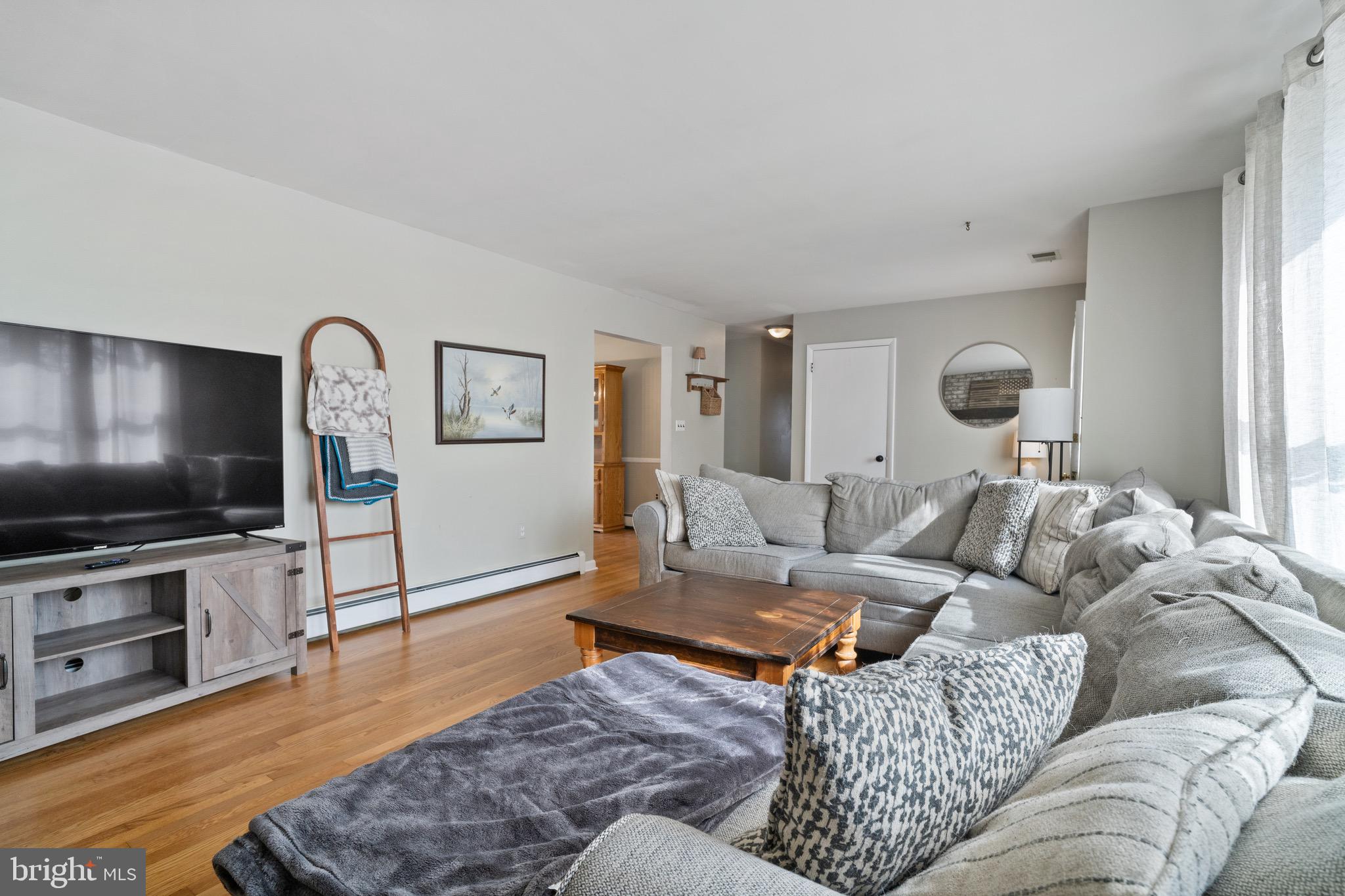 1204 Random Ridge Road Westminster, MD 21157 - Photo 7 of 33 a living room with furniture and a flat screen tv