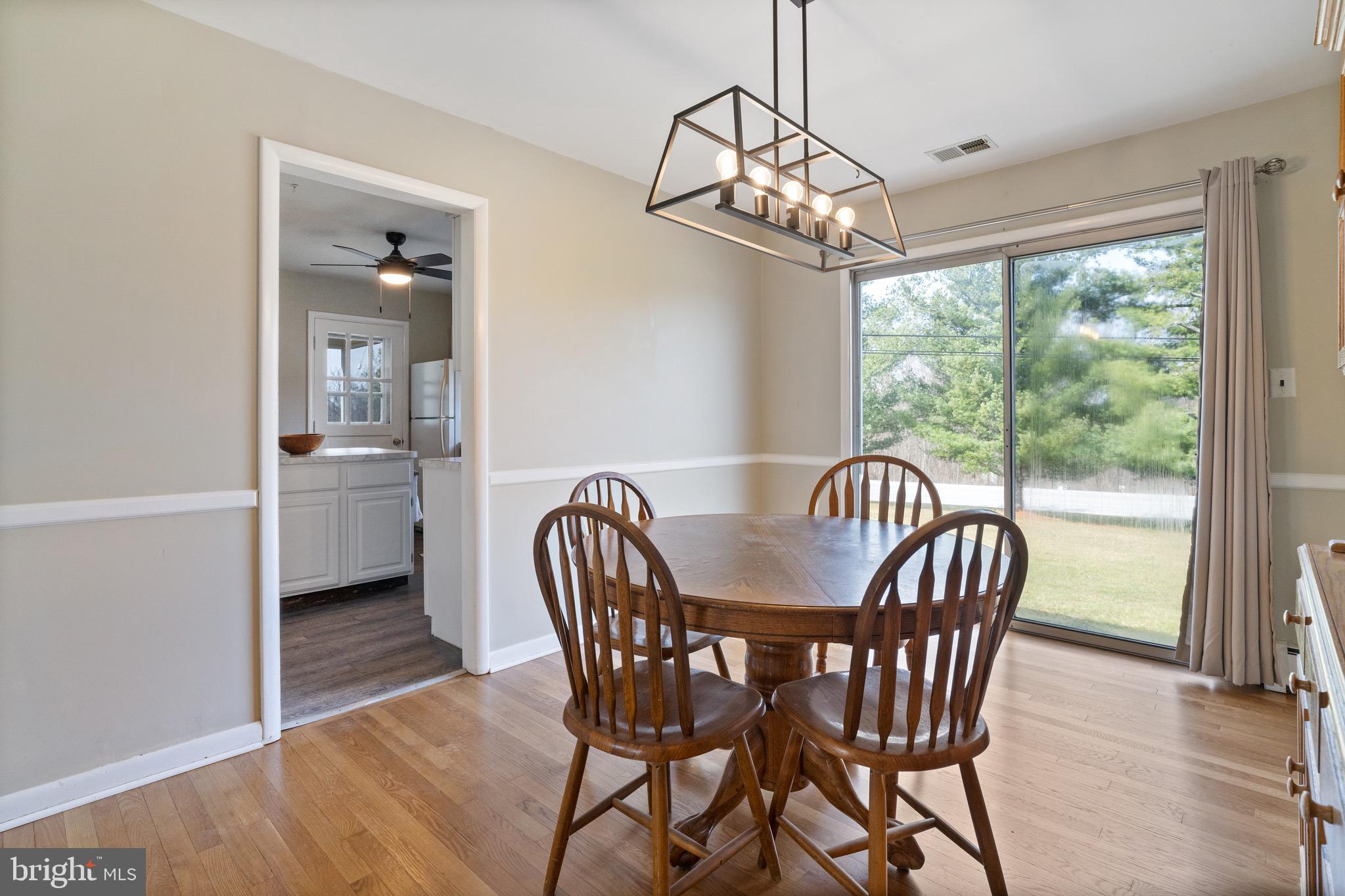 1204 Random Ridge Road Westminster, MD 21157 - Photo 8 of 33 a view of a dining room with furniture window and outside view