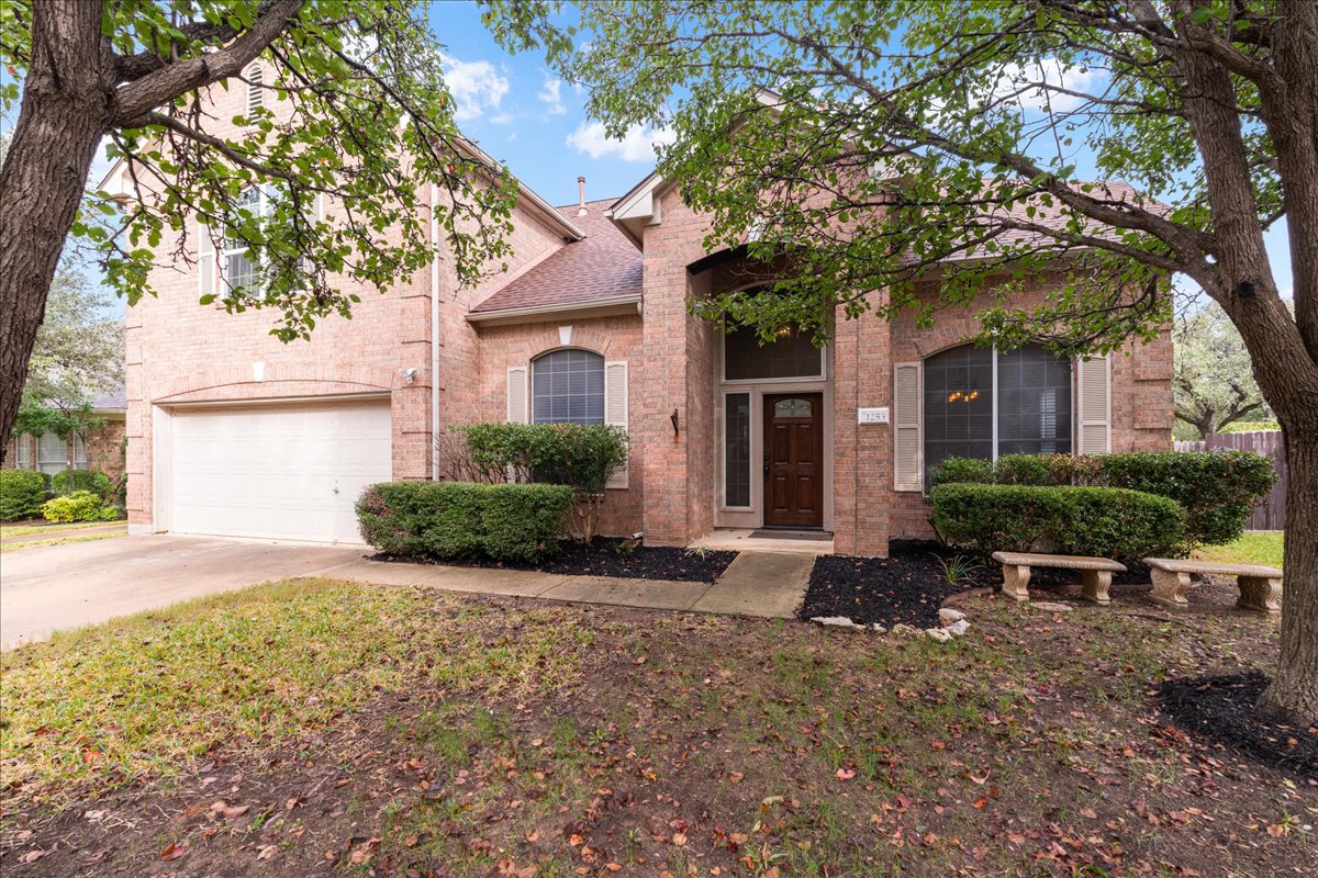 1253 Fall Creek Loop Cedar Park, TX 78613 - Photo 1 of 40 a view of a house with backyard and sitting area