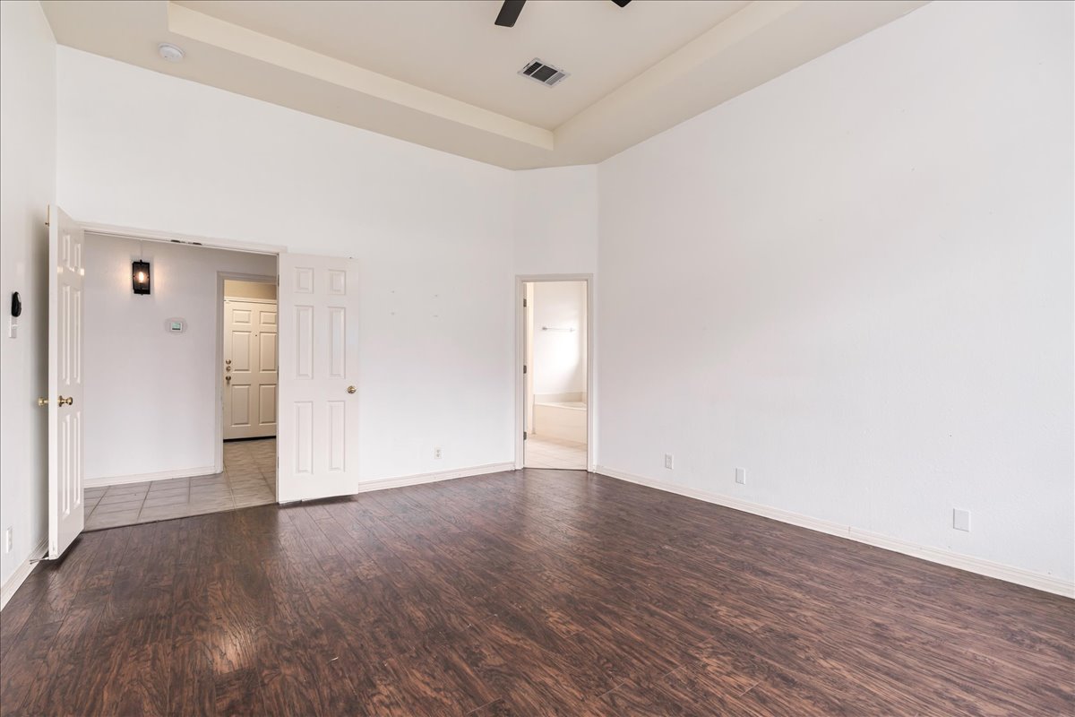 1253 Fall Creek Loop Cedar Park, TX 78613 - Photo 16 of 40 a view of an empty room with wooden floor