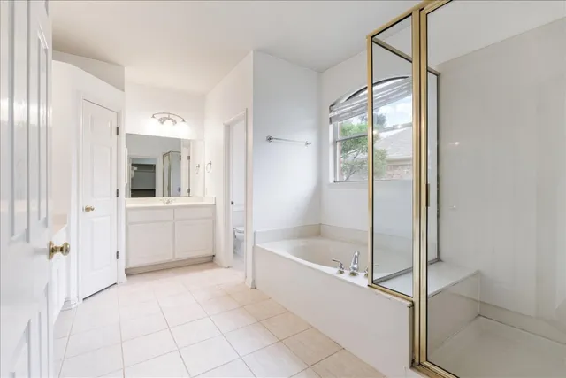 a bathroom with a bathtub and a shower