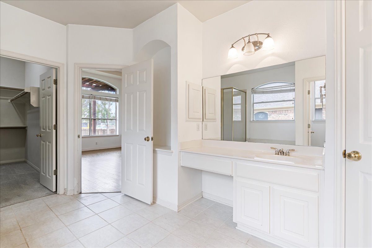 1253 Fall Creek Loop Cedar Park, TX 78613 - Photo 18 of 40 a bathroom with a sink vanity and mirror