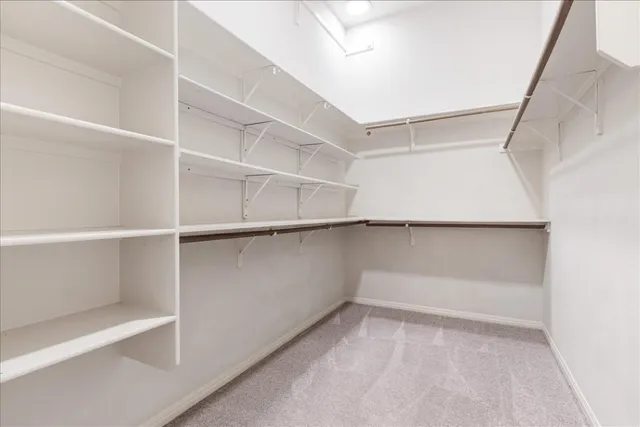 a view of an empty walk in closet