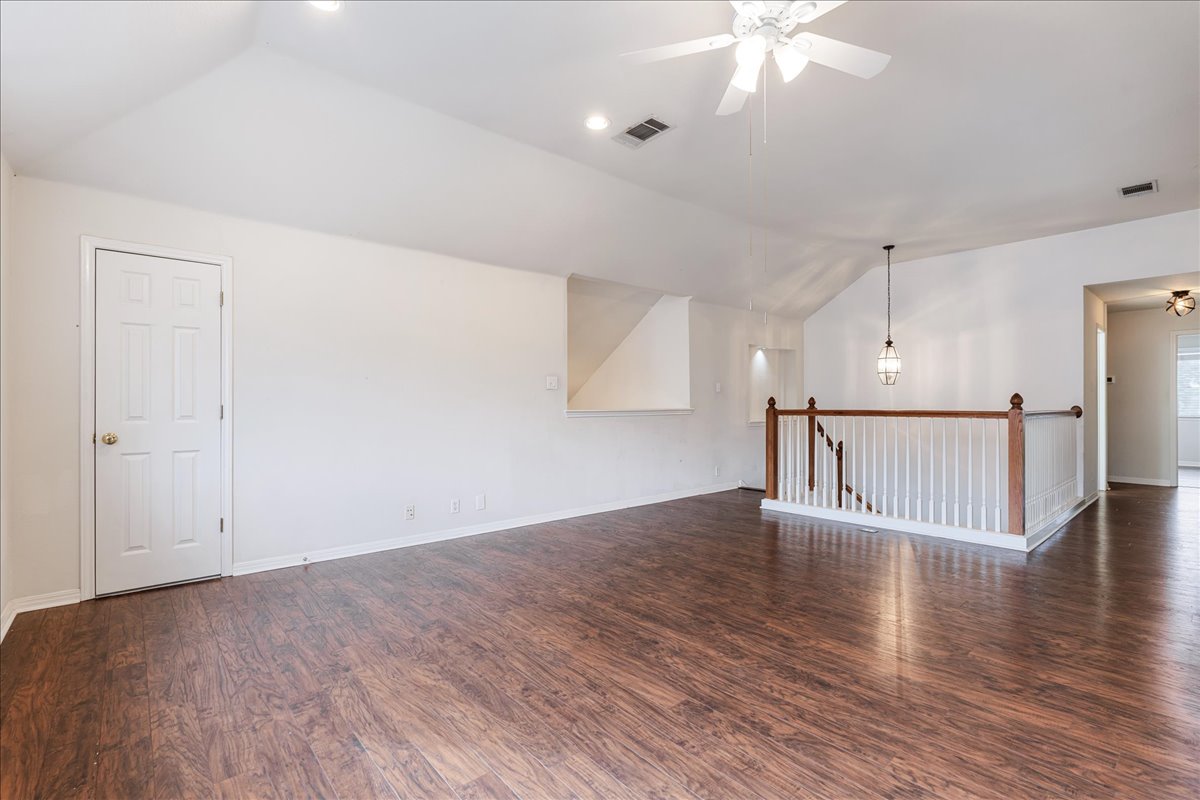 1253 Fall Creek Loop Cedar Park, TX 78613 - Photo 26 of 40 a view of a livingroom with wooden floor and a ceiling fan