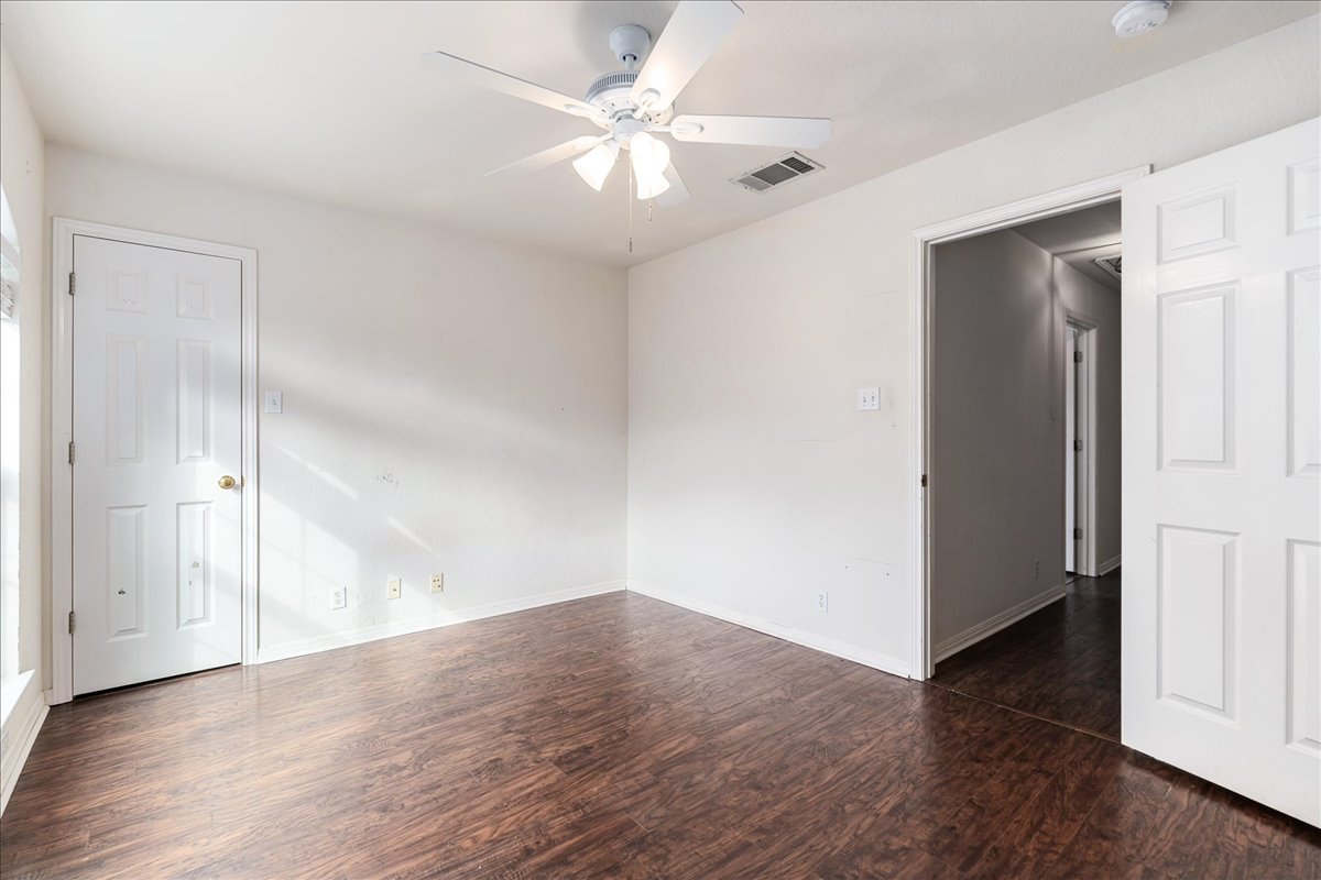 1253 Fall Creek Loop Cedar Park, TX 78613 - Photo 33 of 40 an empty room with wooden floor and ceiling fan