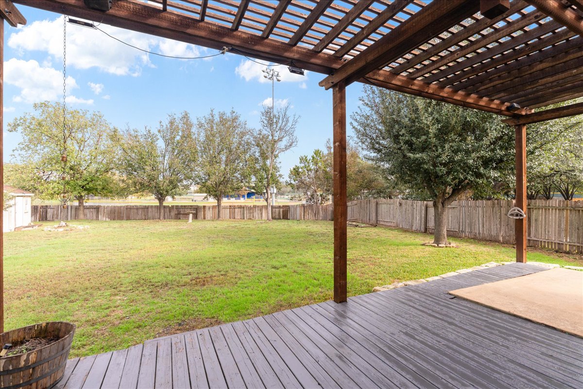 1253 Fall Creek Loop Cedar Park, TX 78613 - Photo 34 of 40 a view of a swimming pool with a patio and a yard