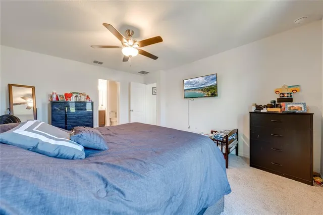 a bathroom with a double vanity sink a mirror and a shower