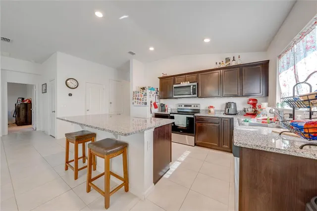 a view of a swimming pool with a table and chairs