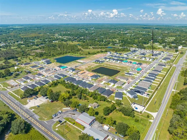 an aerial view of a house with swimming pool