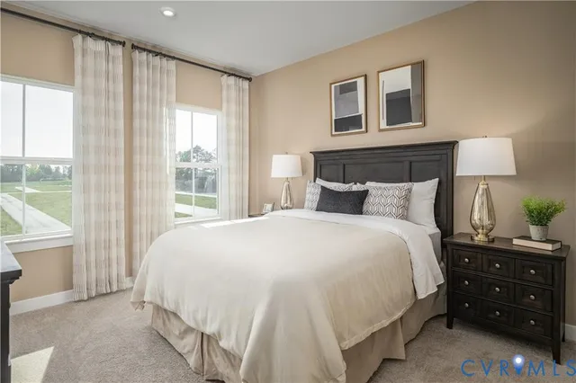 a bedroom with a bed and a night stand