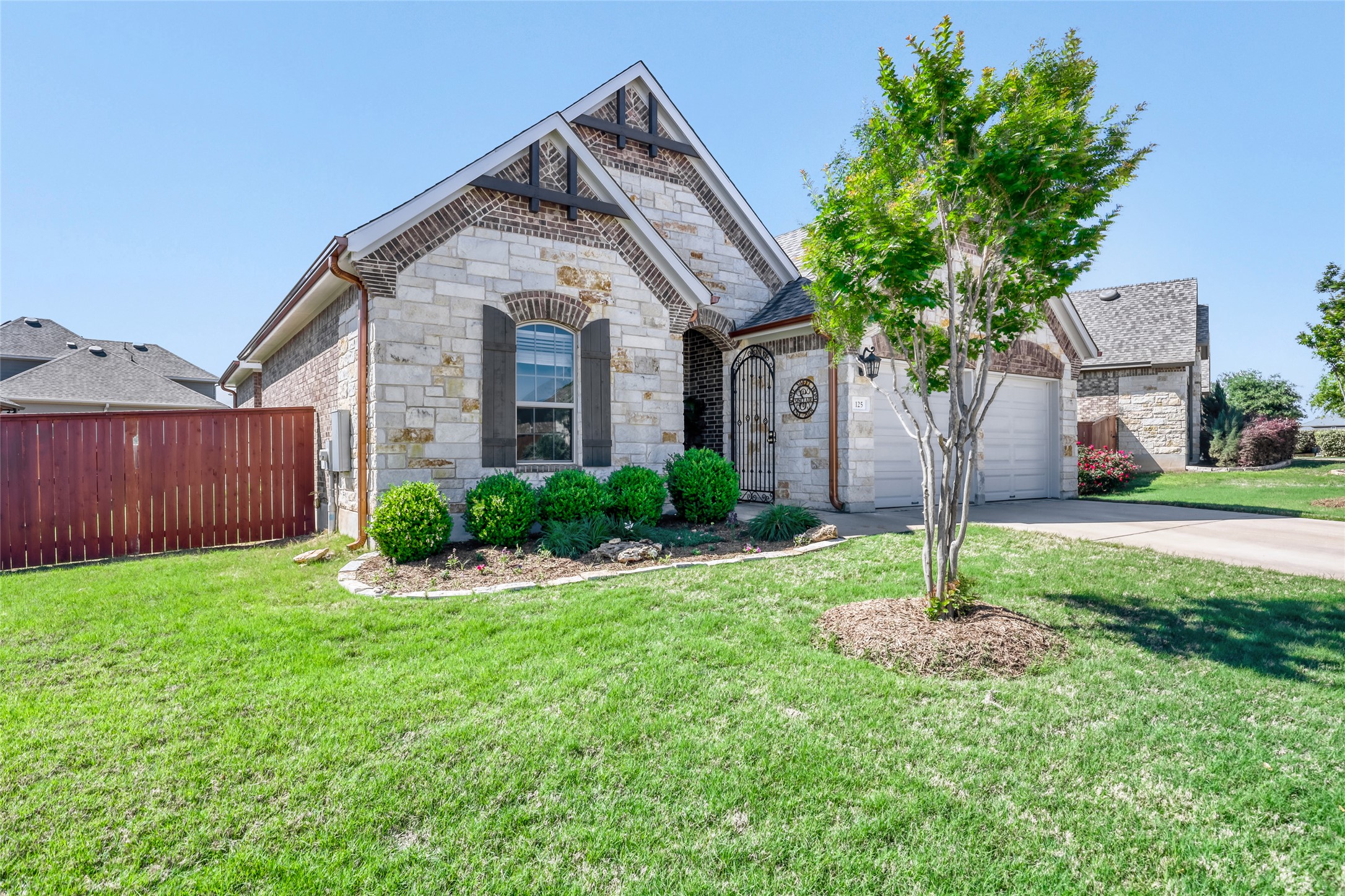 125 Buffalo View Lane Georgetown, TX 78628 - Photo 2 of 28 a front view of a house with garden