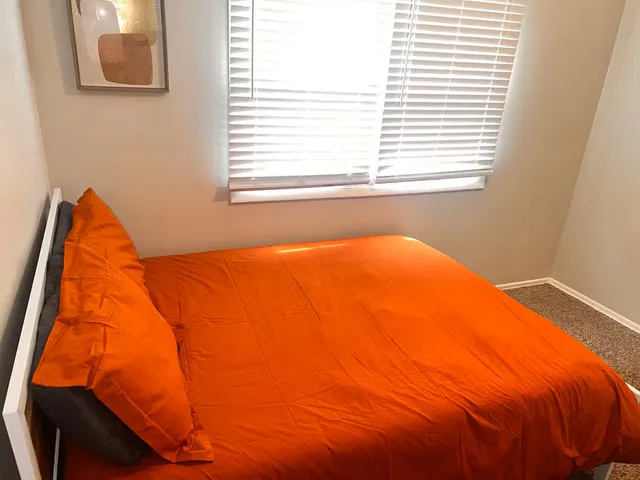 a view of staircase with white walls and a window