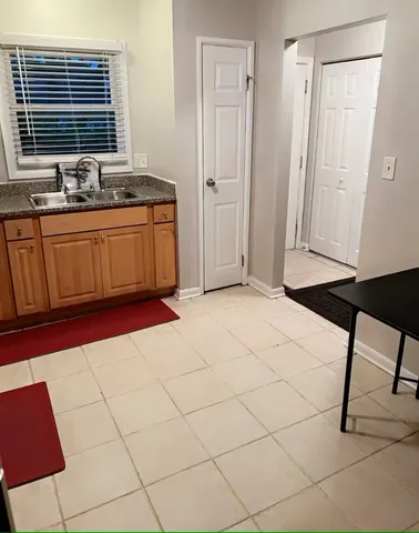 a bathroom with a sink and a window