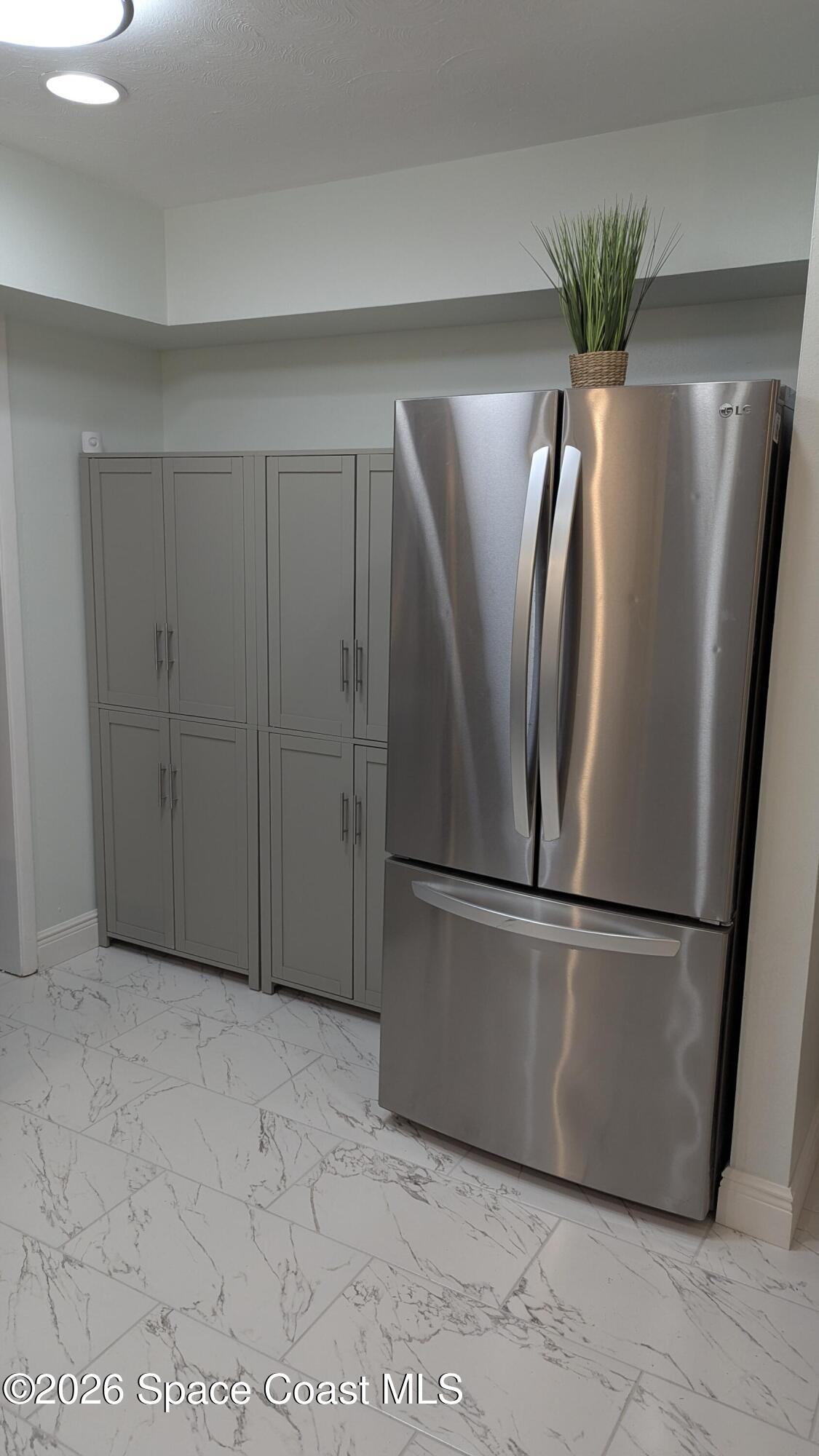 1616 Elizabeth Street Melbourne, FL 32901 - Photo 4 of 14 a view of stainless steel appliances with wooden floor