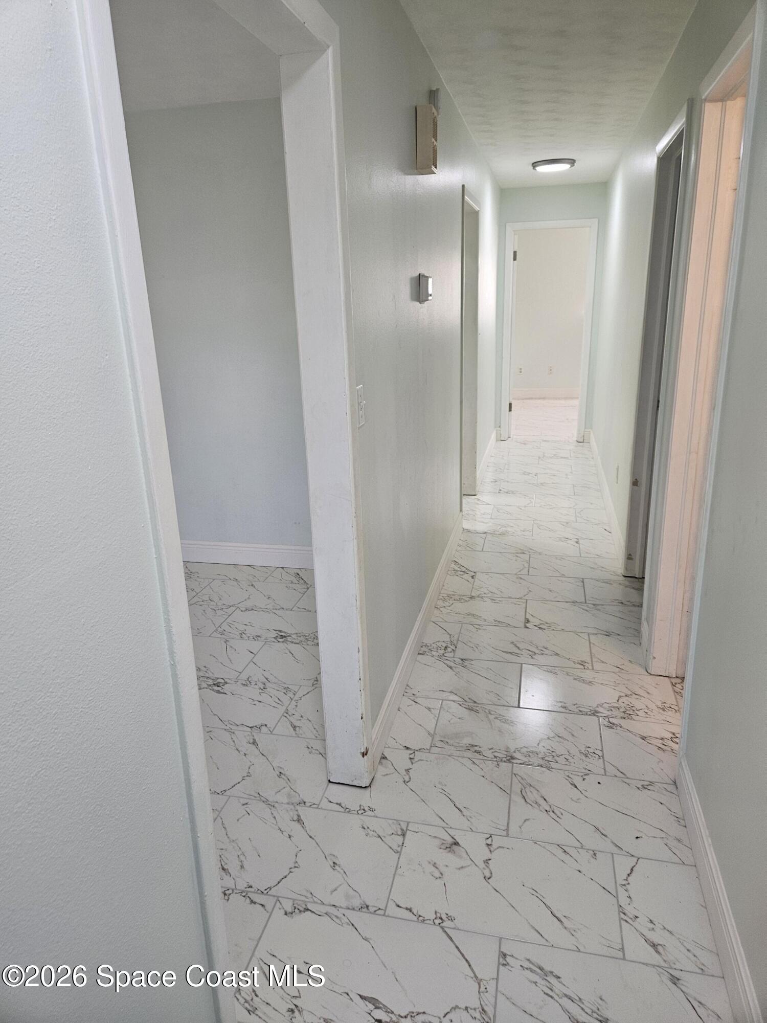 1616 Elizabeth Street Melbourne, FL 32901 - Photo 10 of 14 a view of a bathroom from a hallway