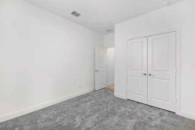a view of a kitchen with a sink and a refrigerator