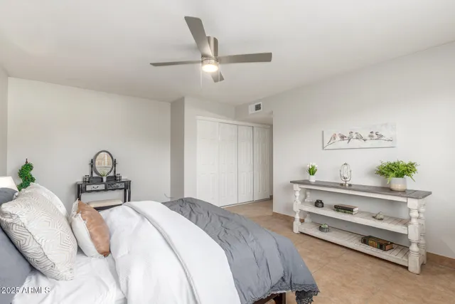 a bedroom with a bed and a dresser