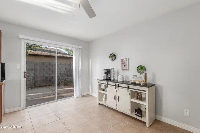 a kitchen with stainless steel appliances a stove and white cabinets