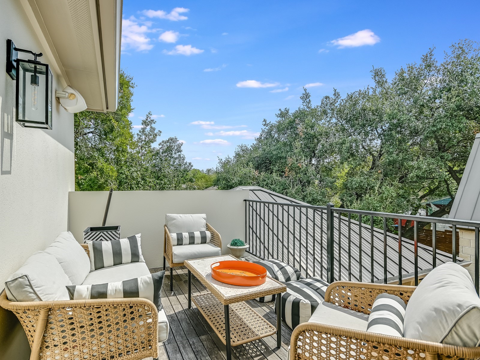 809 Kinney Avenue Austin, TX 78704 - Photo 19 of 21 a roof deck with couches and wooden fence