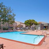 a view of a backyard with a patio