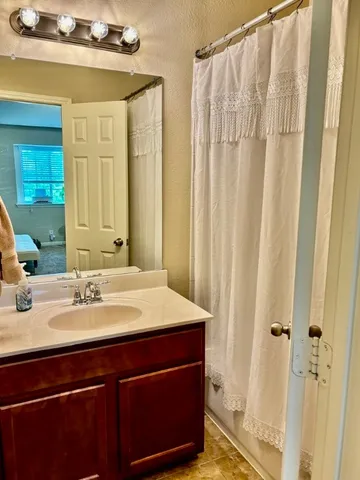a bathroom with a sink and a mirror