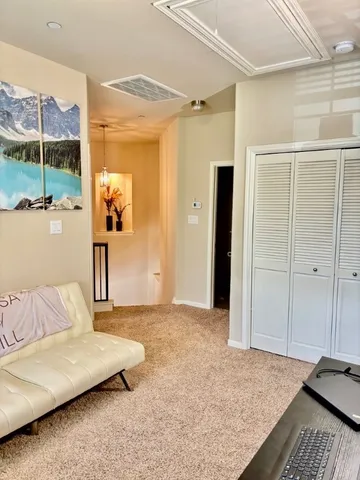 a living room with a couch and a table