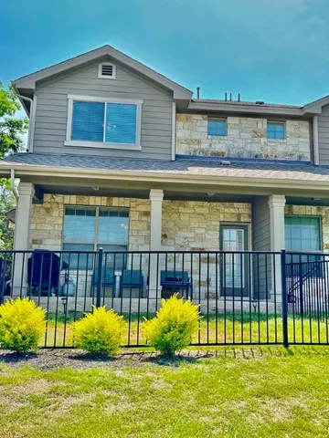 a view of swimming pool with a house