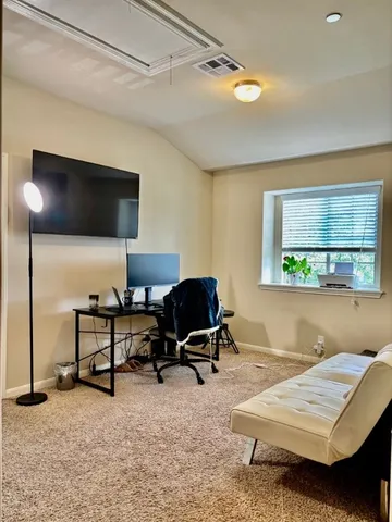 a workspace with furniture and window