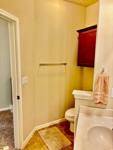 a bathroom with a toilet and a sink