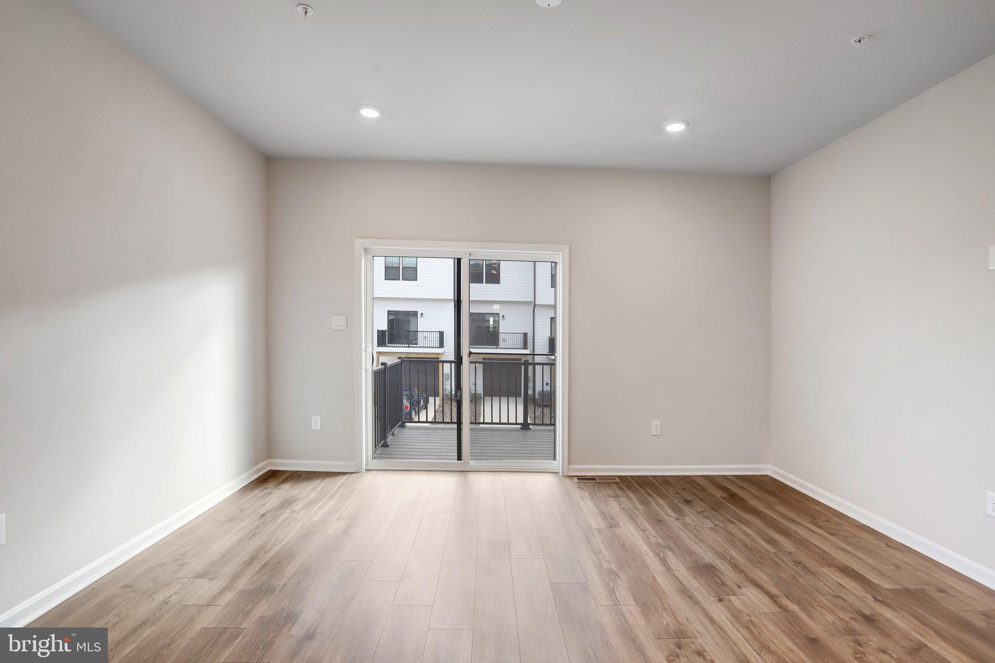 721 Courier Lane Frederick, MD 21701 - Photo 21 of 61 a view of empty room with wooden floor