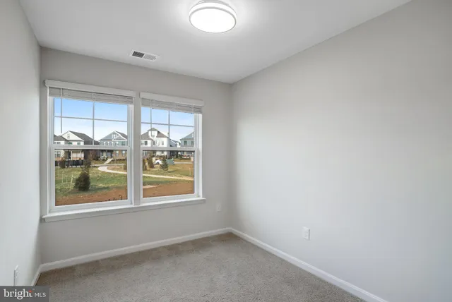 a view of an empty room and a windows