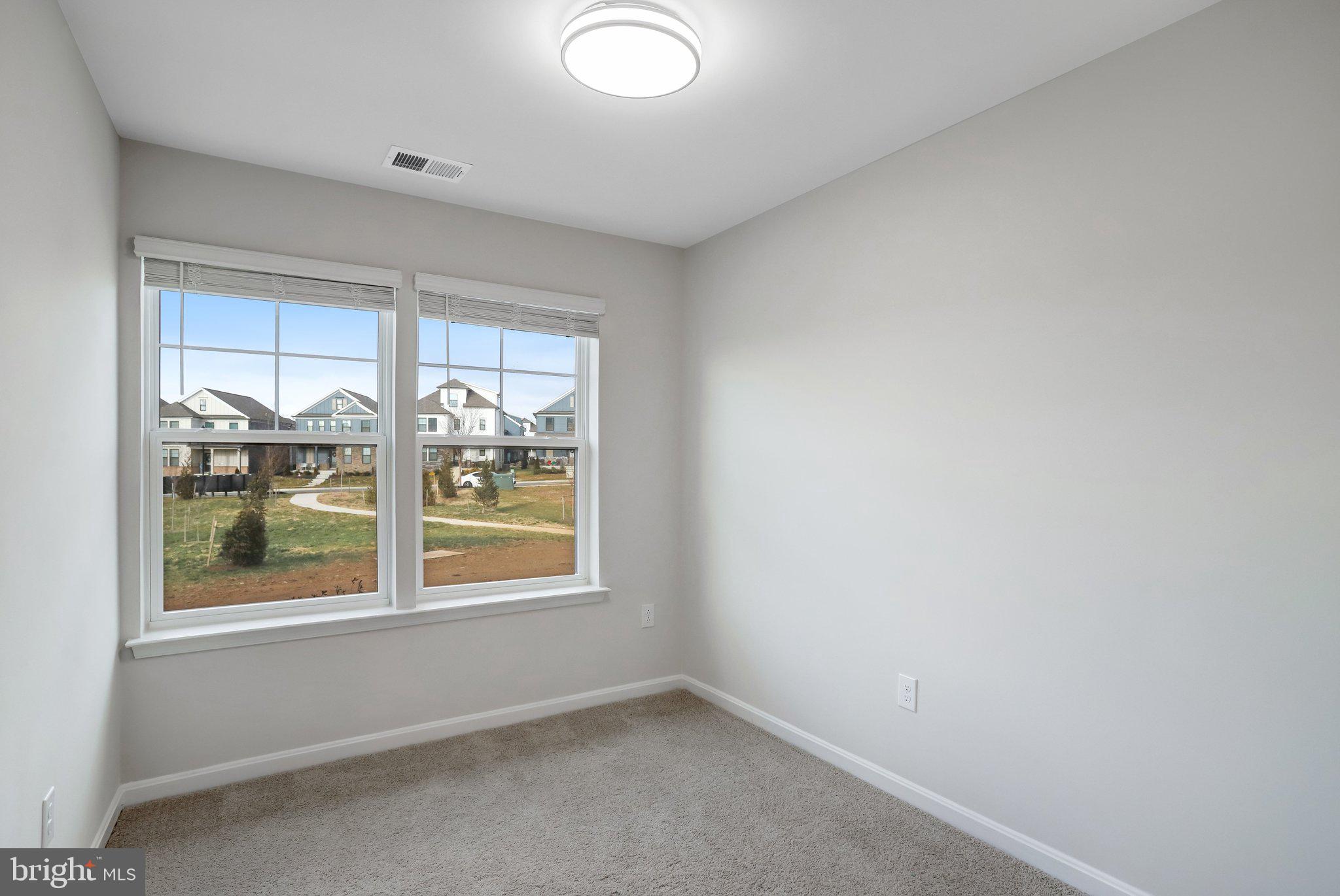 721 Courier Lane Frederick, MD 21701 - Photo 27 of 61 an empty room with windows