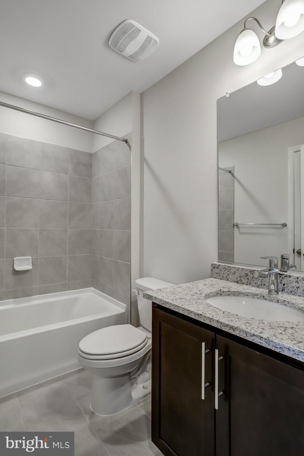 721 Courier Lane Frederick, MD 21701 - Photo 44 of 61 a bathroom with a sink a toilet and shower