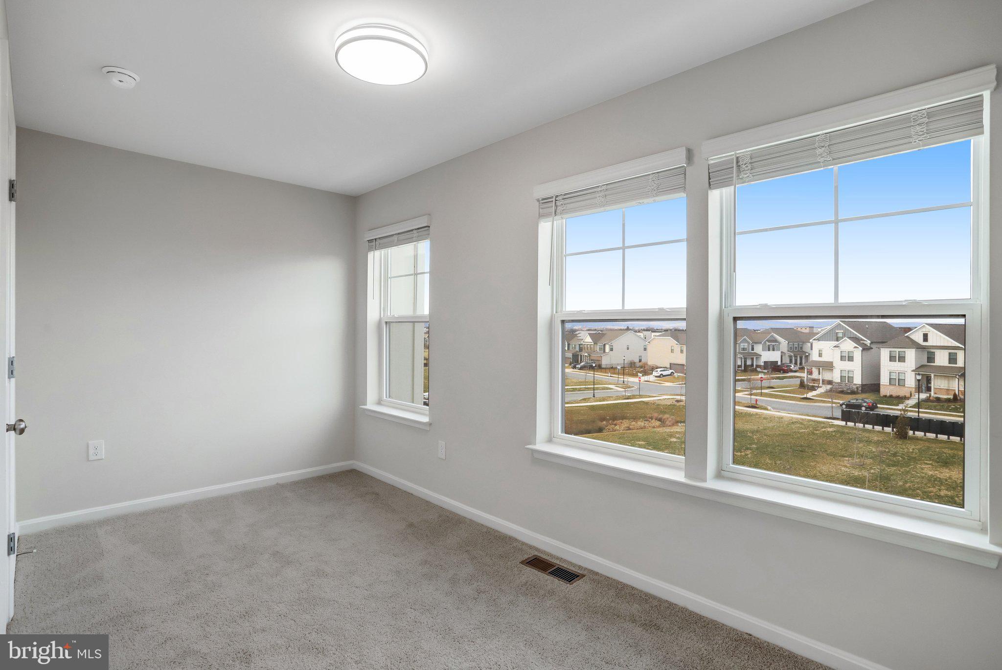 721 Courier Lane Frederick, MD 21701 - Photo 45 of 61 an empty room with a window