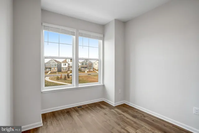 a view of building with swimming pool and patio