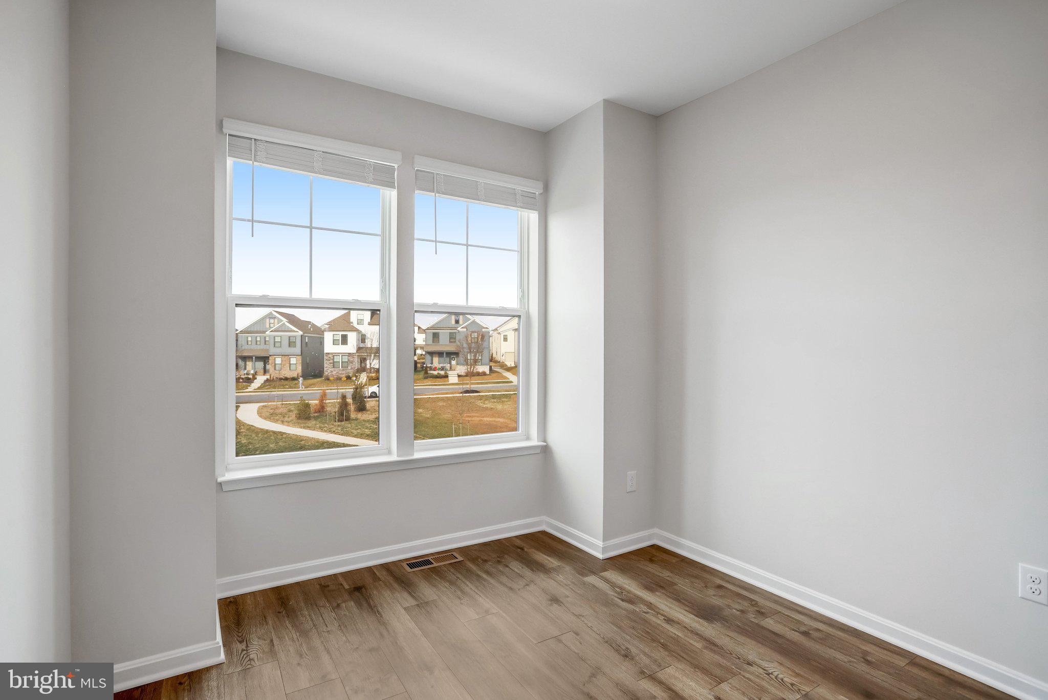 721 Courier Lane Frederick, MD 21701 - Photo 50 of 61 an empty room with windows