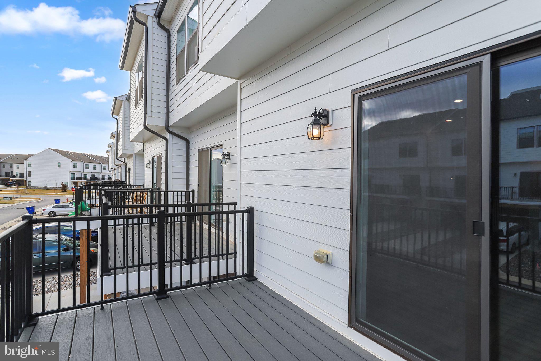 721 Courier Lane Frederick, MD 21701 - Photo 54 of 61 a view of a balcony with wooden floor