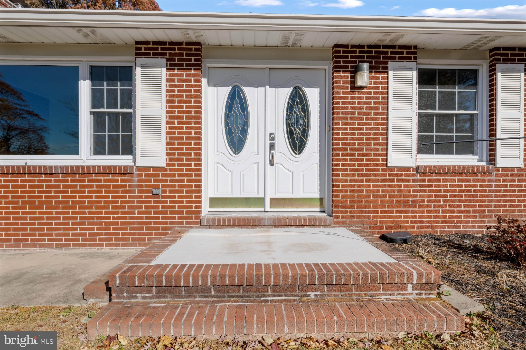 2106 Schuster Road Jarrettsville, MD 21084 - Photo 1 of 28 a view of a brick house with entryway door