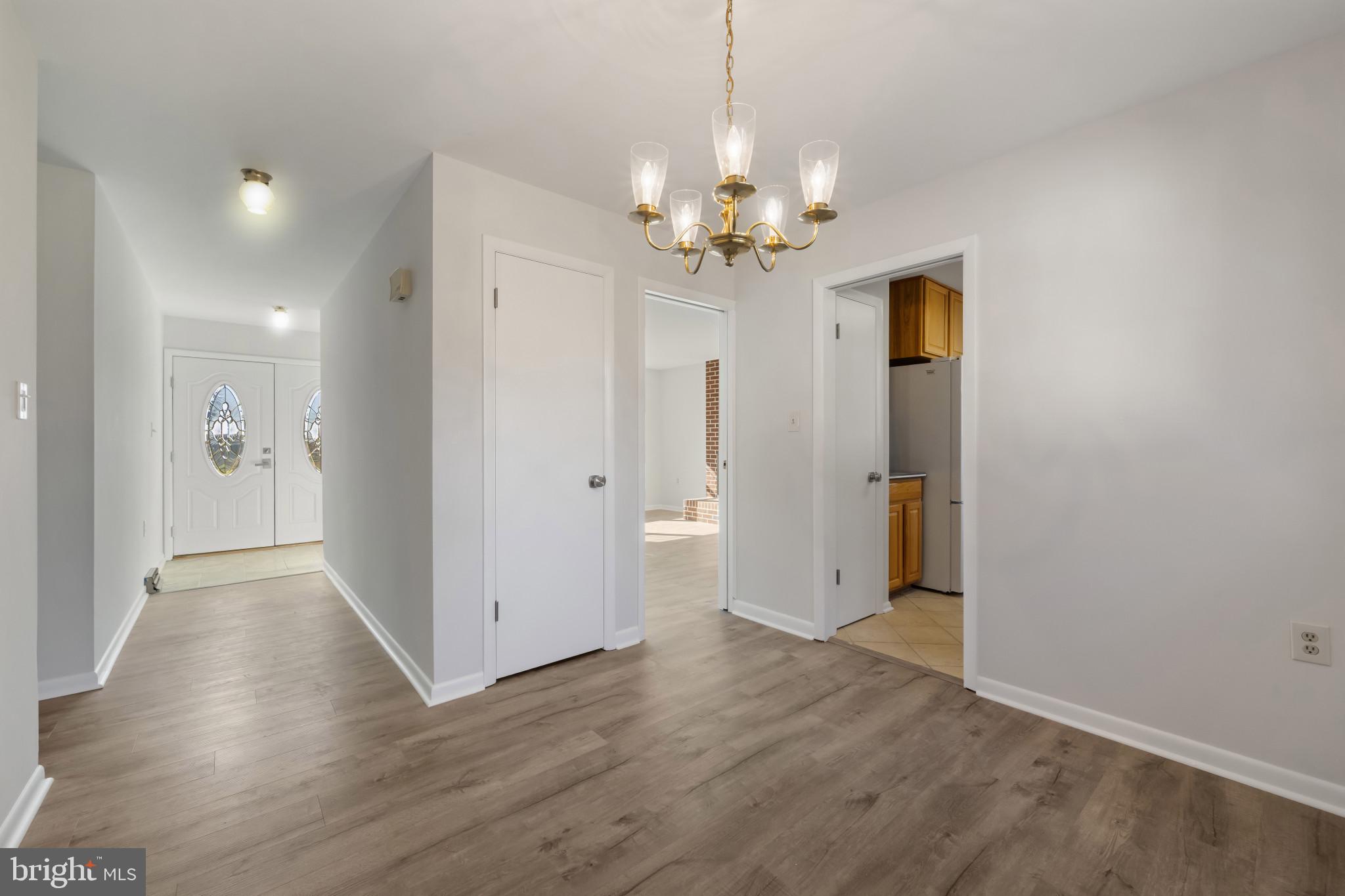 2106 Schuster Road Jarrettsville, MD 21084 - Photo 4 of 28 a view of an empty room with wooden floor