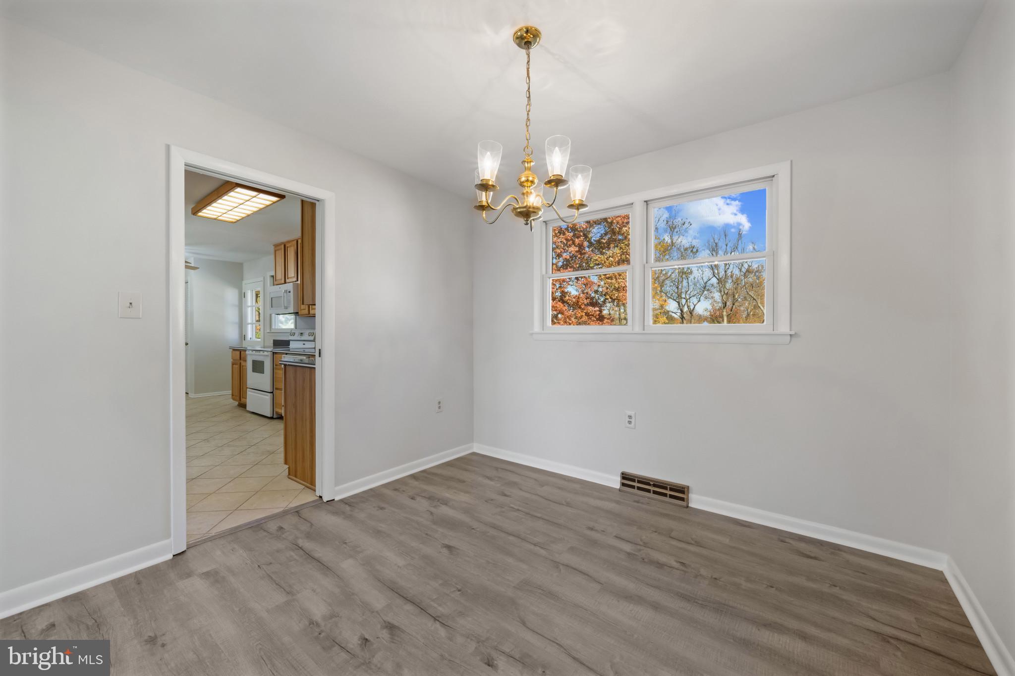 2106 Schuster Road Jarrettsville, MD 21084 - Photo 5 of 28 wooden floor in an empty room with a window