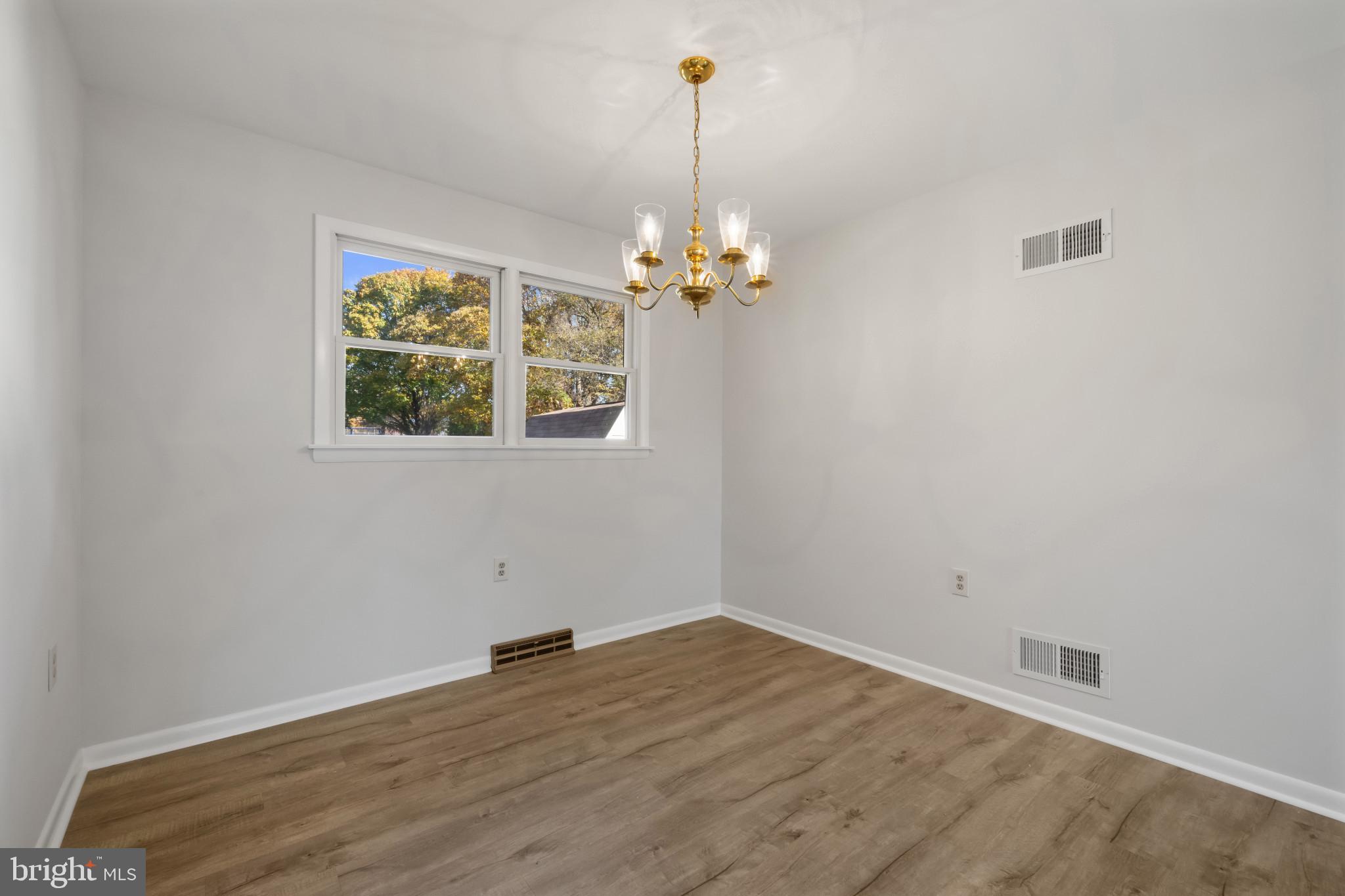 2106 Schuster Road Jarrettsville, MD 21084 - Photo 6 of 28 wooden floor in an empty room with a window