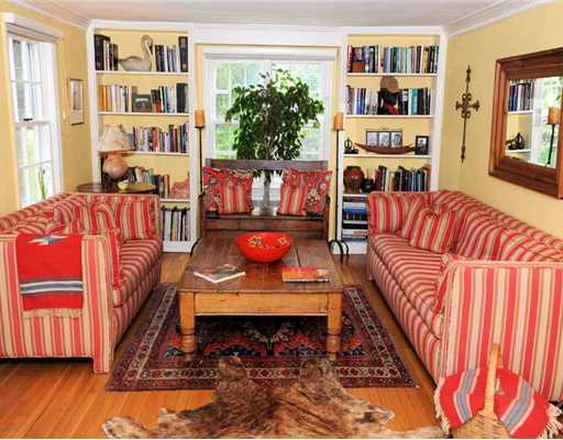 39 Pear Tree Point Road Darien, CT 06820 - Photo 2 of 19 a living room with furniture and a bookshelf