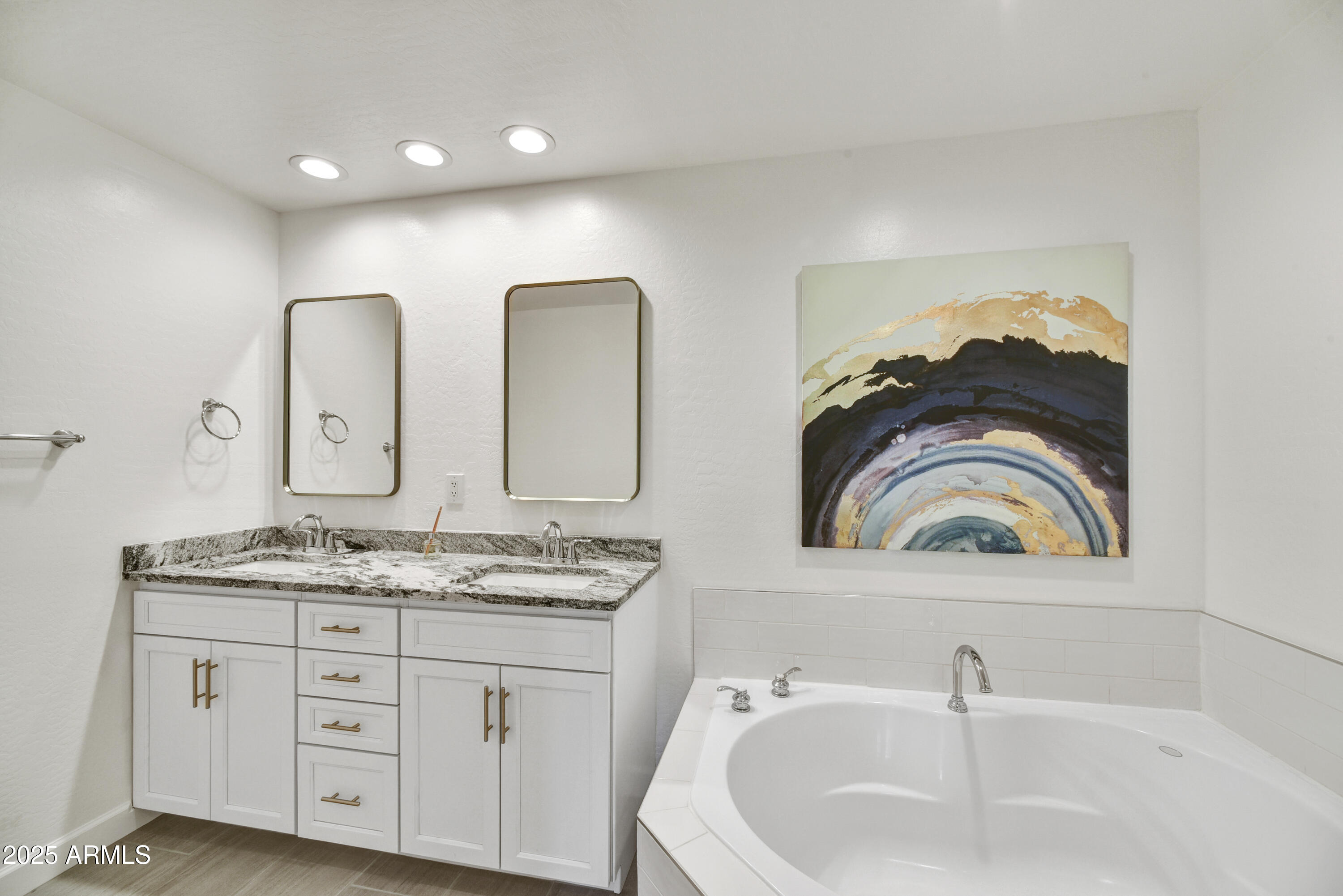 16 West Encanto Boulevard, Unit 22 Phoenix, AZ 85003 - Photo 15 of 34 a bathroom with a double vanity sink and a mirror