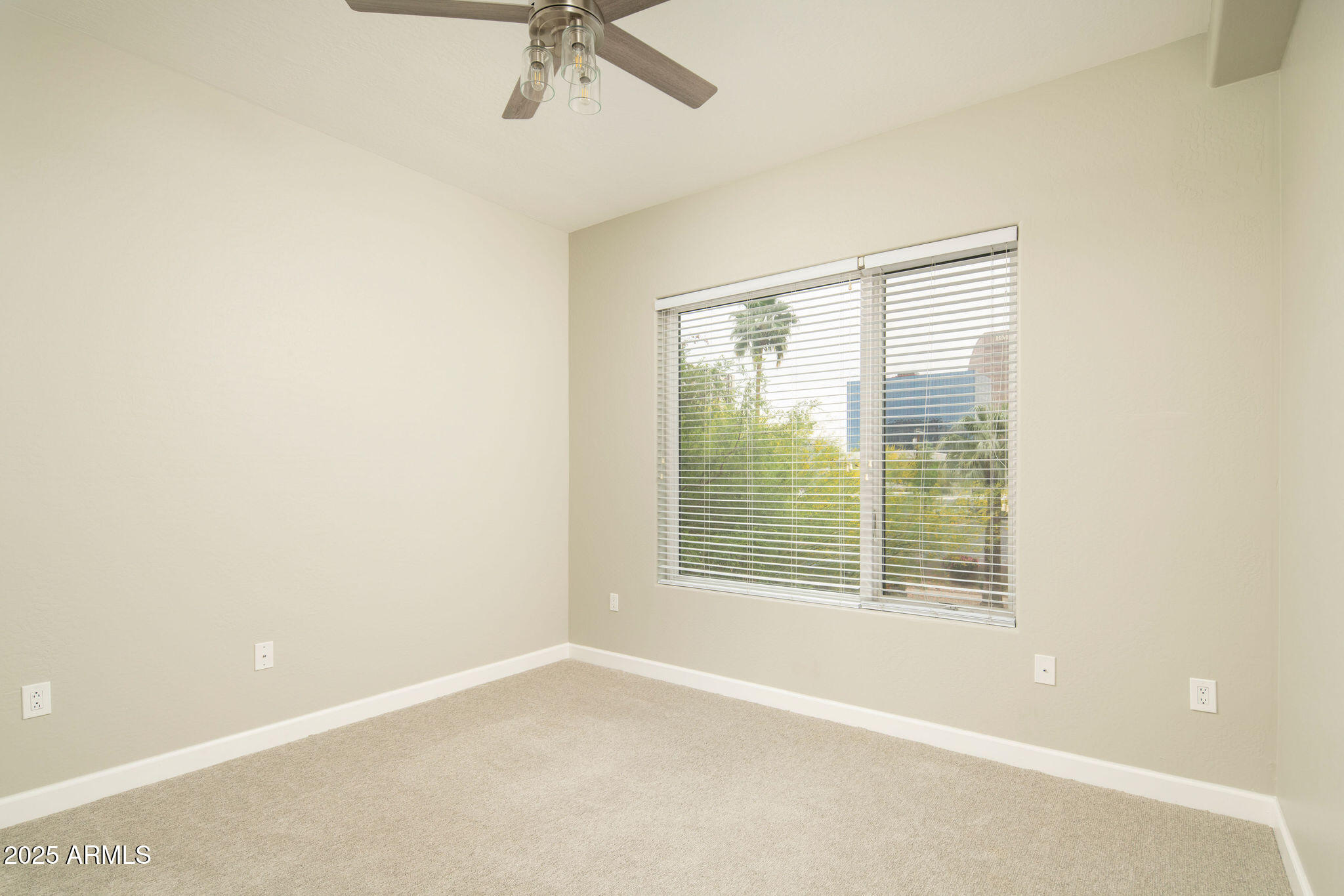 16 West Encanto Boulevard, Unit 22 Phoenix, AZ 85003 - Photo 20 of 34 a view of an empty room with a window