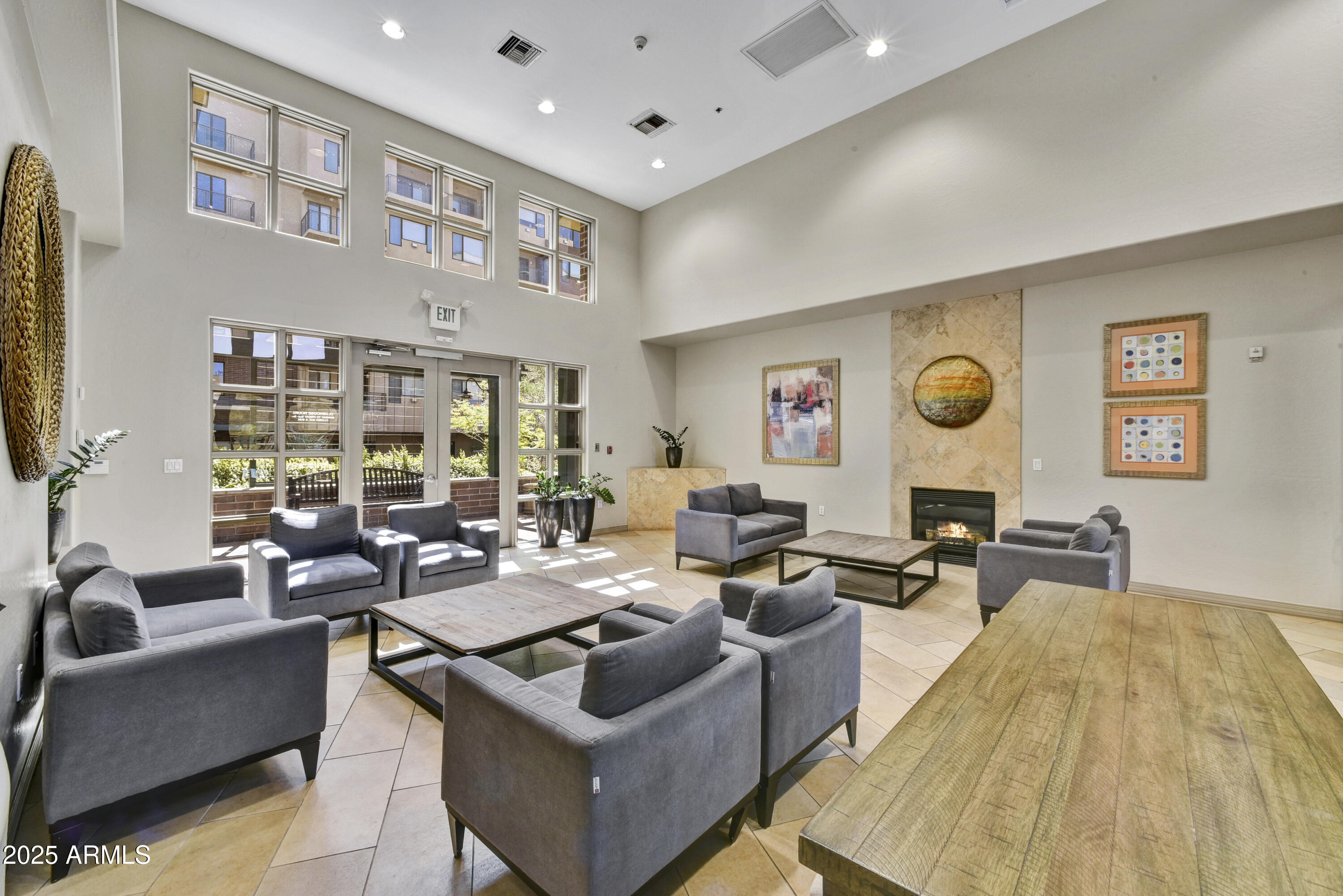 16 West Encanto Boulevard, Unit 22 Phoenix, AZ 85003 - Photo 32 of 34 a living room with furniture and a flat screen tv