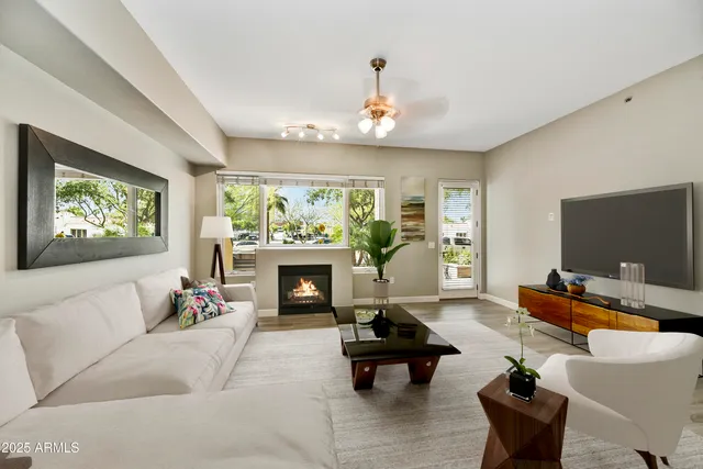 a living room with furniture or couch and a flat screen tv