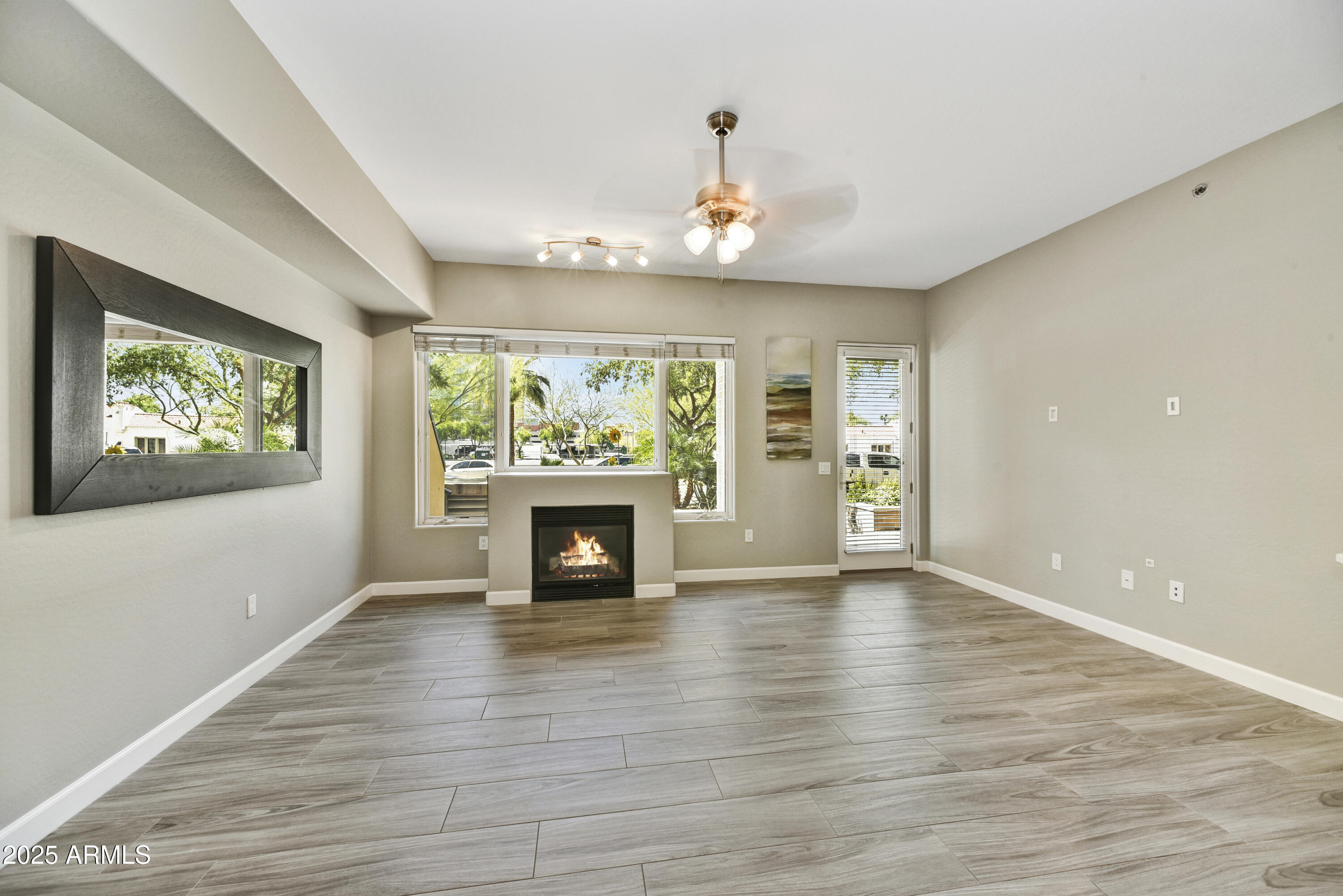 16 West Encanto Boulevard, Unit 22 Phoenix, AZ 85003 - Photo 6 of 34 a view of an empty room with a window and fireplace