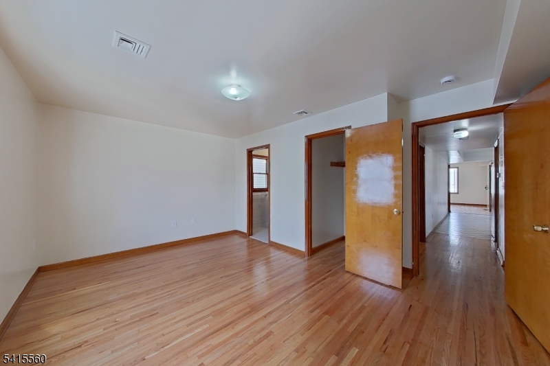 55 Ferguson Street, Unit 2 Newark, NJ 07105 - Photo 18 of 25 a view of a hallway with wooden floor