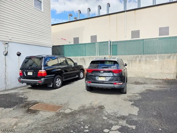 a view of a car parked in front of a house