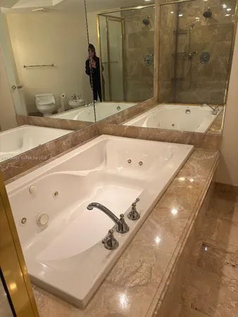 a bathroom with a tub and a sink